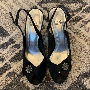 Stuart Weitzman black platform peep toe heels.